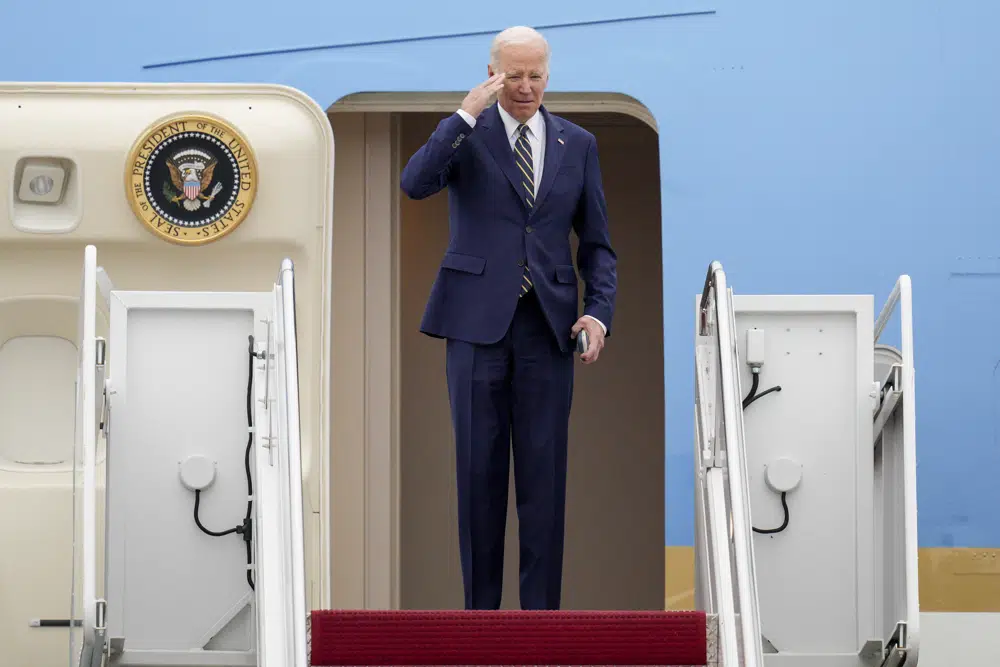 President Joe Biden returns a salute as he boards Air Force One at Andrews Air Force Base, Md., Thursday, Jan. 19, 2023, en route to California. (AP Photo/Jess Rapfogel)